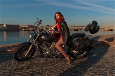 Lady in Red on a Black Motorbike